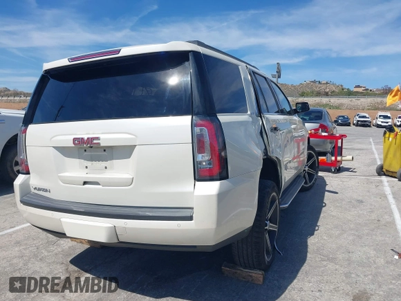 2015 GMC Yukon SLT with VIN 1GKS1BKC3FR102961, listed as a IAAI auction lot 41872717 with 1 mi miles. Bid and sale history available at carsss.com. Image 4.