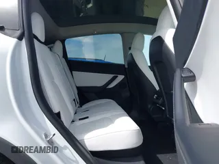 2021 Tesla Model Y Performance z VIN 5YJYGDEF7MF277769, wystawiony jako IAAI lot #42025157 z przebiegiem 28 522 mil mil oraz . Historia ofert i sprzedaży dostępna na DreamBid. Obrazek 8.