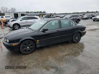 2004 Jaguar X-Type with VIN SAJEA51C34WD80242, listed as a Copart auction lot 48487885 with 197,518 mi miles and Salvage Title. Bid and sale history available at carsss.com. Image 1.