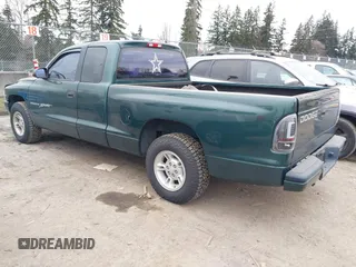 2000 Dodge Dakota Sport with VIN 1B7GL22N6YS764185, listed as a IAAI auction lot 41570275 with 157,334 mi miles. Bid and sale history available at carsss.com. Image 3.