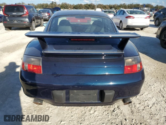 2000 Porsche 911 z VIN WP0AA2996YS621130, wystawiony jako Copart lot #77096434 z przebiegiem Nie podano mil oraz Szkoda całkowita • Salvage title. Historia ofert i sprzedaży dostępna na DreamBid. Obrazek 6.