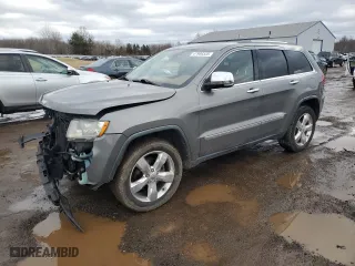 2012 Jeep Grand Cherokee Overland with VIN 1C4RJFCG3CC132303, listed as a Copart auction lot 47980335 with 113,598 mi miles and Salvage Title. Bid and sale history available at carsss.com. Image 1.