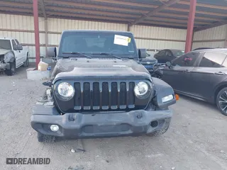 2020 Jeep Wrangler Unlimited Sport Altitude with VIN 1C4HJXDGXLW329841, listed as a IAAI auction lot 41060142 with 57,243 mi miles. Bid and sale history available at carsss.com. Image 12.