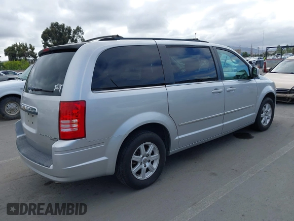 2010 Chrysler Town & Country Touring with VIN 2A4RR5D11AR432126, listed as a IAAI auction lot 42261584 with 135,638 mi miles and . Bid and sale history available at DreamBid. Image 4.