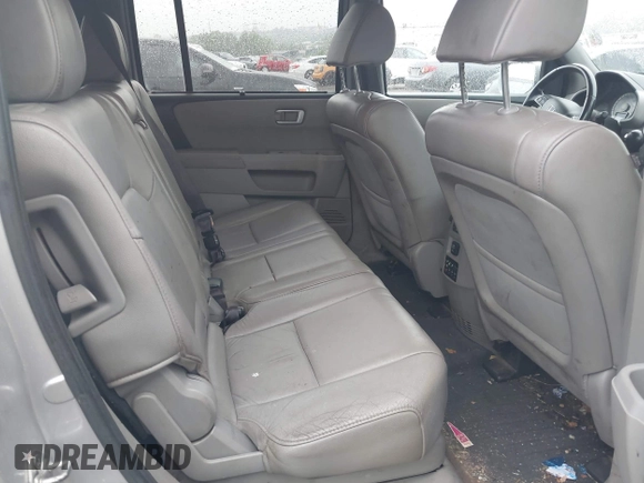 2013 Honda Pilot Touring z VIN 5FNYF4H96DB051005, wystawiony jako IAAI lot #42211189 z przebiegiem 215 594 mil mil oraz . Historia ofert i sprzedaży dostępna na DreamBid. Obrazek 8.
