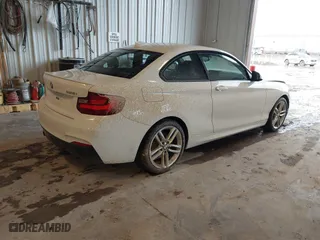 2016 BMW 2 Series 228i xDrive with VIN WBA1G9C53GVX97088, listed as a IAAI auction lot 41617710 with 72,978 mi miles. Bid and sale history available at carsss.com. Image 4.