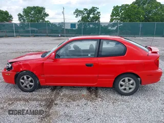 2003 Hyundai Accent GL z VIN KMHCG35CX3U247788, wystawiony jako IAAI lot #42254692 z przebiegiem 89 560 mil mil oraz . Historia ofert i sprzedaży dostępna na DreamBid. Obrazek 14.