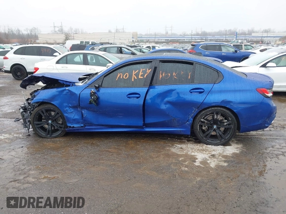 2022 BMW 3 Series 330i z VIN 3MW5R1J06N8C49056, wystawiony jako IAAI lot #41496252 z przebiegiem Nie podano mil oraz . Historia ofert i sprzedaży dostępna na DreamBid. Obrazek 13.