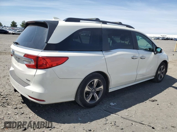 2018 Honda Odyssey Touring with VIN 5FNRL6H8XJB018438, listed as a Copart auction lot 61876505 with 104,581 mi miles and Salvage title. Bid and sale history available at DreamBid. Image 3.
