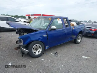 1998 Ford F-150 XL with VIN 2FTZX0722WCA65198, listed as a IAAI auction lot 42145451 with 188,529 mi miles and . Bid and sale history available at DreamBid. Image 2.