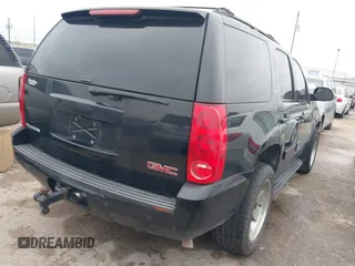 2014 GMC Yukon SLT with VIN 1GKS1CE02ER207447, listed as a IAAI auction lot 41604134 with 199,417 mi miles. Bid and sale history available at carsss.com. Image 4.