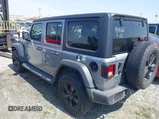 2021 Jeep Wrangler Unlimited Sport Altitude with VIN 1C4HJXDGXMW662493, listed as a IAAI auction lot 41288957 with 64,808 mi miles and . Bid and sale history available at DreamBid. Image 3.
