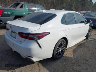2023 Toyota Camry SE with VIN 4T1T11AK8PU826299, listed as a IAAI auction lot 41633276 with 64,107 mi miles. Bid and sale history available at carsss.com. Image 4.