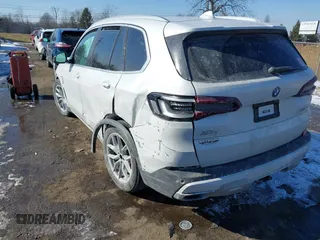 2023 BMW X5 xDrive45e with VIN 5UXTA6C00P9P14126, listed as a IAAI auction lot 41553162 with 36,654 mi miles. Bid and sale history available at carsss.com. Image 3.