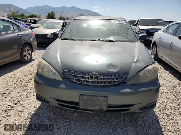 2002 Toyota Camry LE z VIN JTDBE32K120068644, wystawiony jako Copart lot #61168915 z przebiegiem 210 149 mil mil oraz Czysty tytuł • Clean title. Historia ofert i sprzedaży dostępna na DreamBid. Obrazek 5.