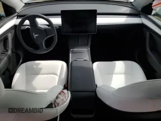 2023 Tesla Model Y Long Range z VIN 7SAYGDEE3PF815088, wystawiony jako Copart lot #54849895 z przebiegiem 19 637 mil mil oraz Szkoda całkowita • Salvage title. Historia ofert i sprzedaży dostępna na DreamBid. Obrazek 8.
