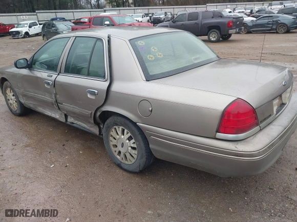 2005 Ford Crown Victoria LX with VIN 2FAFP74W05X174758, listed as a IAAI auction lot 41553606 with 192,103 mi miles. Bid and sale history available at carsss.com. Image 3.