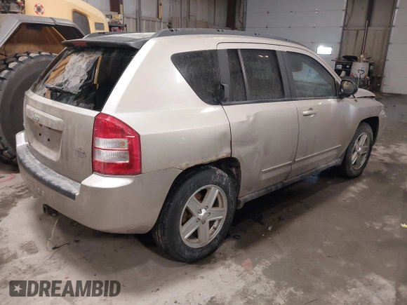 2010 Jeep Compass Sport with VIN 1J4NF4FB7AD501587, listed as a IAAI auction lot 41514419 with 154,826 mi miles. Bid and sale history available at carsss.com. Image 4.