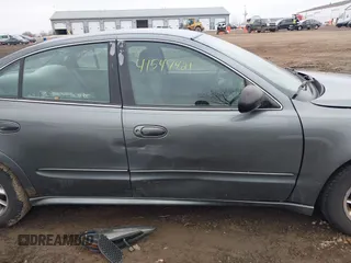 2004 Pontiac Grand Am SE with VIN 1G2NE52FX4M674634, listed as a IAAI auction lot 41547421 with 125,225 mi miles. Bid and sale history available at carsss.com. Image 13.