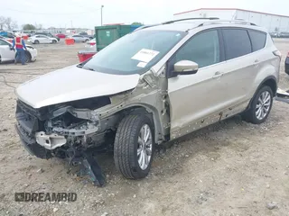 2017 Ford Escape Titanium with VIN 1FMCU0JD2HUC30884, listed as a IAAI auction lot 41801272 with 111,644 mi miles. Bid and sale history available at carsss.com. Image 2.