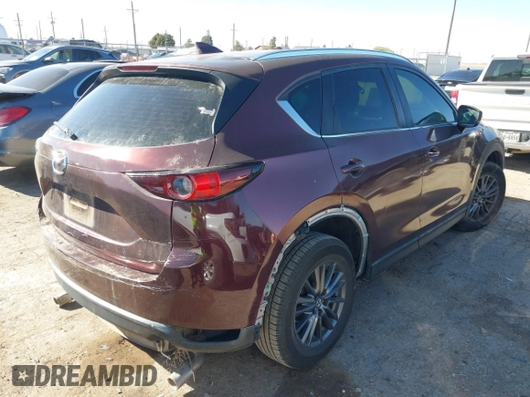 2019 Mazda CX-5 Sport with VIN JM3KFABM2K0686372, listed as a IAAI auction lot 41770183 with 57,202 mi miles and . Bid and sale history available at DreamBid. Image 4.