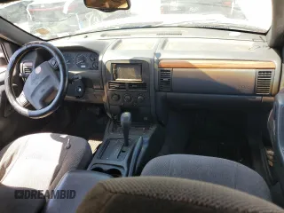 1999 Jeep Grand Cherokee Laredo z VIN 1J4G258SXXC518308, wystawiony jako Copart lot #56636235 z przebiegiem 233 649 mil mil oraz Szkoda całkowita • Salvage title. Historia ofert i sprzedaży dostępna na DreamBid. Obrazek 8.