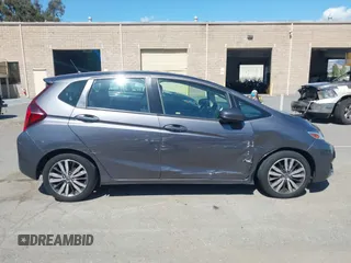 2015 Honda Fit EX-L z VIN 3HGGK5H86FM746265, wystawiony jako IAAI lot #42253205 z przebiegiem 75 491 mil mil oraz . Historia ofert i sprzedaży dostępna na DreamBid. Obrazek 13.