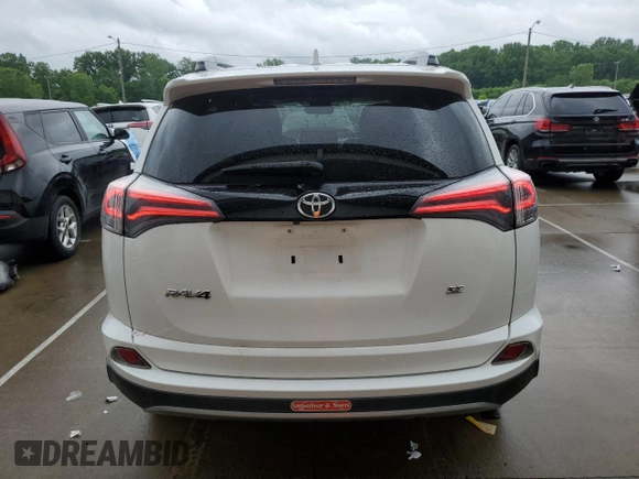 2018 Toyota RAV4 SE with VIN 2T3NFREV5JW416779, listed as a Copart auction lot 60283105 with 64,255 mi miles and Salvage title. Bid and sale history available at DreamBid. Image 6.