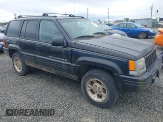 1998 Jeep Grand Cherokee Limited with VIN 1J4GZ78YXWC141912, listed as a IAAI auction lot 41972948 with 291,801 mi miles. Bid and sale history available at carsss.com. Image 1.