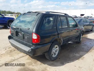 2001 Isuzu Rodeo S with VIN 4S2CK58W114363340, listed as a IAAI auction lot 41498698 with 185,408 mi miles and . Bid and sale history available at DreamBid. Image 4.
