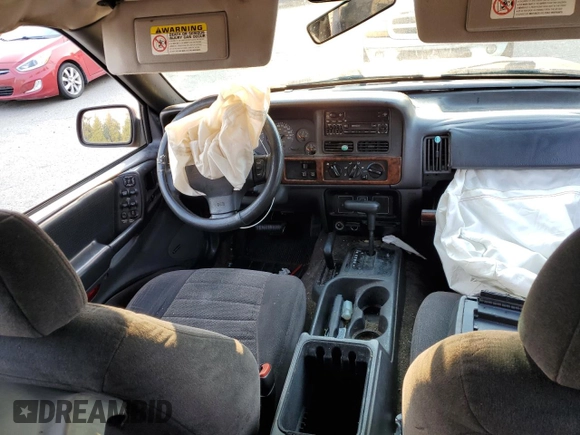 1996 Jeep Grand Cherokee z VIN 1J4EZ58Y5TC142263, wystawiony jako Copart lot #70532894 z przebiegiem Nie podano mil oraz Szkoda całkowita • Salvage title. Historia ofert i sprzedaży dostępna na DreamBid. Obrazek 8.