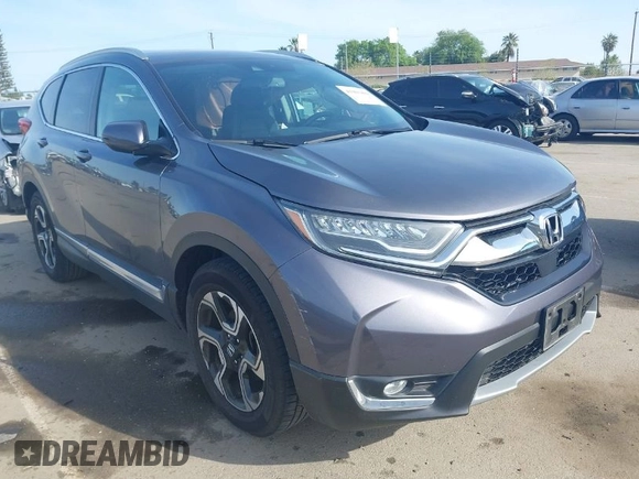 2018 Honda CR-V Touring with VIN 7FARW1H93JE027294, listed as a IAAI auction lot 41903484 with 80,999 mi miles and . Bid and sale history available at DreamBid. Image 1.