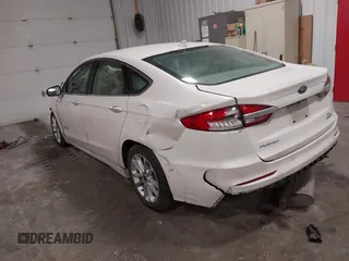 2019 Ford Fusion Hybrid SEL with VIN 3FA6P0MU8KR272811, listed as a IAAI auction lot 41705282 with 56,565 mi miles. Bid and sale history available at carsss.com. Image 3.