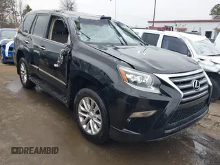 2014 Lexus GX 460 with VIN JTJBM7FX6E5073973, listed as a IAAI auction lot 41610332 with 128,870 mi miles. Bid and sale history available at carsss.com. Image 1.