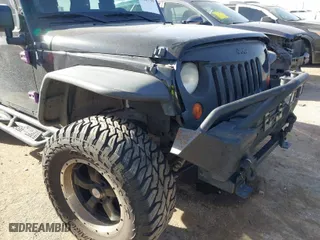2013 Jeep Wrangler Unlimited Sport with VIN 1C4BJWDG9DL569109, listed as a IAAI auction lot 41207715 with 120,800 mi miles. Bid and sale history available at carsss.com. Image 6.