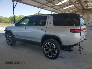 2025 Rivian R1S Adventure z VIN 7PDSGBBA9SN052652, wystawiony jako Copart lot #51659315 z przebiegiem 4012 mil mil oraz Szkody całkowita. Historia ofert i sprzedaży dostępna na DreamBid. Obrazek 2.