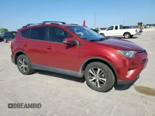 2018 Toyota RAV4 XLE with VIN JTMRFREV4JD234778, listed as a Copart auction lot 52715065 with 131,407 mi miles and Salvage Title. Bid and sale history available at carsss.com. Image 4.