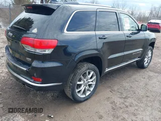 2015 Jeep Grand Cherokee Summit with VIN 1C4RJFJGXFC882787, listed as a IAAI auction lot 42098274 with 147,020 mi miles and . Bid and sale history available at DreamBid. Image 4.