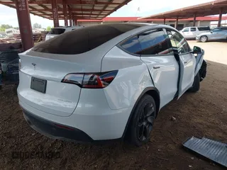2021 Tesla Model Y Long Range with VIN 5YJYGAEE9MF254113, listed as a IAAI auction lot 42045256 with Not Provided miles. Bid and sale history available at carsss.com. Image 4.
