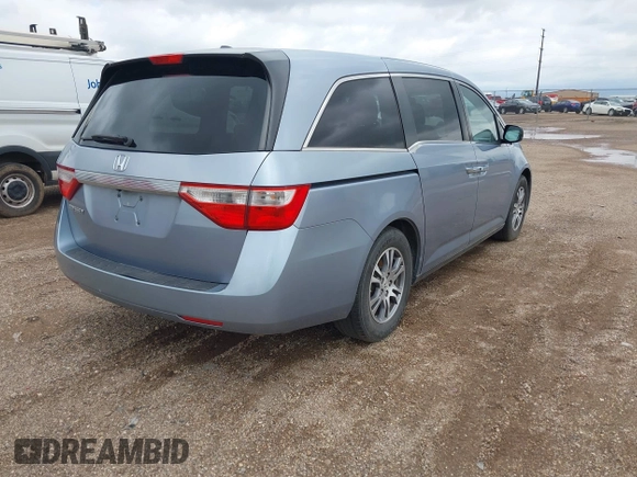 2011 Honda Odyssey EX-L with VIN 5FNRL5H64BB085479, listed as a IAAI auction lot 42404637 with 185,624 mi miles and . Bid and sale history available at DreamBid. Image 4.