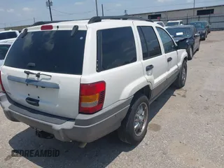 2003 Jeep Grand Cherokee Laredo with VIN 1J4GX48S63C546208, listed as a IAAI auction lot 42288811 with 141,696 mi miles and . Bid and sale history available at DreamBid. Image 4.