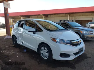 2020 Honda Fit LX z VIN 3HGGK5H45LM717560, wystawiony jako IAAI lot #41679343 z przebiegiem 47 134 mil mil oraz . Historia ofert i sprzedaży dostępna na DreamBid. Obrazek 1.