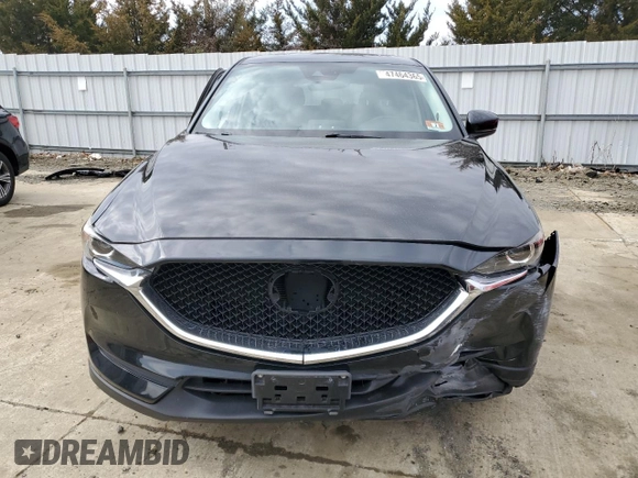2017 Mazda CX-5 Touring with VIN JM3KFACLXH0195725, listed as a Copart auction lot 47464365 with 65,457 mi miles and Salvage Title. Bid and sale history available at carsss.com. Image 5.