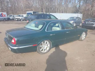 2004 Jaguar XJ with VIN SAJWA71C74SG22814, listed as a IAAI auction lot 41649399 with 114,841 mi miles. Bid and sale history available at carsss.com. Image 4.