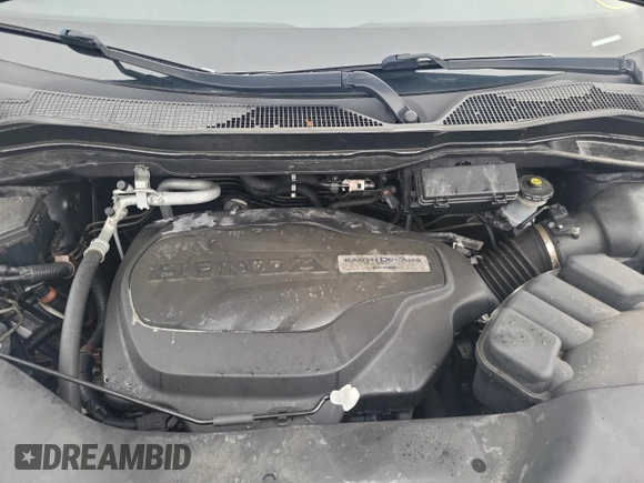 2018 Honda Pilot Touring z VIN 5FNYF6H93JB500695, wystawiony jako Copart lot #83302284 z przebiegiem 12 086 mil mil oraz Szkoda całkowita • Salvage title. Historia ofert i sprzedaży dostępna na DreamBid. Obrazek 12.