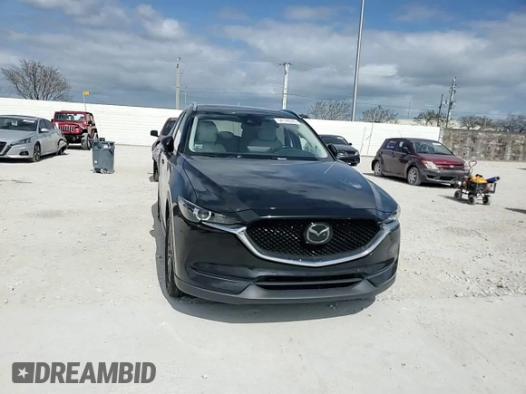 2021 Mazda CX-5 Touring z VIN JM3KFBCM8M1436782, wystawiony jako Copart lot #54144645 z przebiegiem 52 388 mil mil oraz Szkoda całkowita • Salvage title. Historia ofert i sprzedaży dostępna na DreamBid. Obrazek 14.