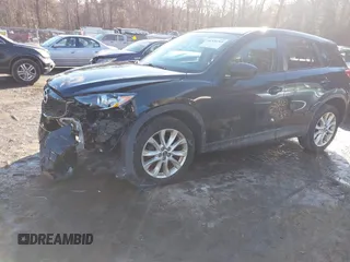2014 Mazda CX-5 Grand Touring with VIN JM3KE4DY1E0303658, listed as a IAAI auction lot 41536769 with 158,777 mi miles. Bid and sale history available at carsss.com. Image 2.