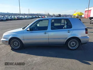 1999 Volkswagen Golf z VIN 3VWJA81HXXM215507, wystawiony jako IAAI lot #41391464 z przebiegiem 167 875 mil mil oraz . Historia ofert i sprzedaży dostępna na DreamBid. Obrazek 14.