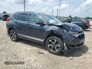 2018 Honda CR-V Touring with VIN 2HKRW2H9XJH605264, listed as a Copart auction lot 61500315 with 106,616 mi miles and Salvage title. Bid and sale history available at DreamBid. Image 4.