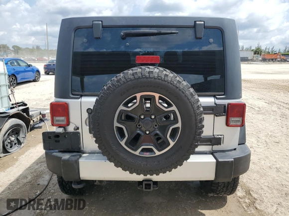 2012 Jeep Wrangler Unlimited Sport z VIN 1C4BJWDG8CL220960, wystawiony jako Copart lot #57823315 z przebiegiem 177 541 mil mil oraz Szkoda całkowita • Salvage title. Historia ofert i sprzedaży dostępna na DreamBid. Obrazek 6.